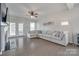 Spacious living room boasts hardwood floors, a fireplace, and a large sofa at 217 Barberry Dr, Belmont, NC 28012