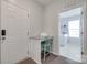 Convenient mudroom area with a countertop, chair, and access to the laundry room at 217 Barberry Dr, Belmont, NC 28012