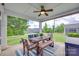 Relaxing screened porch with a dining table, bench, and view of the backyard at 217 Barberry Dr, Belmont, NC 28012
