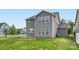 A spacious backyard with lush green grass and a concrete patio, perfect for outdoor entertaining at 2327 Glenway Trail Ct, Pineville, NC 28134