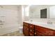Bathroom featuring a double sink vanity, a large mirror and shower-tub combination at 2327 Glenway Trail Ct, Pineville, NC 28134