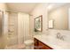 A virtually staged full bathroom features a double vanity, large mirror and shower-tub combination at 2327 Glenway Trail Ct, Pineville, NC 28134