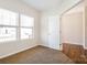 Bedroom with neutral carpet, a bright window, and a doorway leading to another room at 2327 Glenway Trail Ct, Pineville, NC 28134