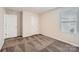 Bedroom featuring plush carpeting, a large window, and a closet with a clean, white door at 2327 Glenway Trail Ct, Pineville, NC 28134