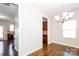 Dining room showcasing access to the kitchen, hard wood floors, and natural light at 2327 Glenway Trail Ct, Pineville, NC 28134