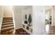 Virtually staged entryway with modern mudroom built-ins and a staircase to the second floor at 2327 Glenway Trail Ct, Pineville, NC 28134