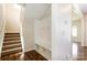 Inviting entryway with a built-in mudroom bench and coat hooks, offering both style and practicality at 2327 Glenway Trail Ct, Pineville, NC 28134