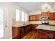 Kitchen with stainless steel appliances, beautiful granite countertops and wooden cabinetry at 2327 Glenway Trail Ct, Pineville, NC 28134