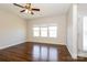 The living room features ample light from large windows, creating a bright and welcoming atmosphere at 2327 Glenway Trail Ct, Pineville, NC 28134