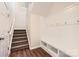 Bright mudroom with convenient built-in storage and coat rack near the staircase at 2327 Glenway Trail Ct, Pineville, NC 28134
