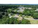 An aerial view showcases the neighborhood, displaying the lush green trees, varied roof types and overall community layout at 2336 32Nd Ne St, Hickory, NC 28601