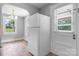 A view of the kitchen featuring a full sized refrigerator and a doorway leading to the backyard at 2336 32Nd Ne St, Hickory, NC 28601
