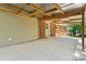 Covered patio with large awning, brick house, and garage are ideal for outdoor entertaining and storage at 2401 Woodleaf Dr, Gastonia, NC 28052