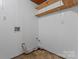 Utility basement featuring plumbing, electrical, shelving, and a concrete floor at 2401 Woodleaf Dr, Gastonia, NC 28052