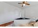 Bright bedroom featuring hardwood floors, neutral walls, and a ceiling fan to complete the space at 2401 Woodleaf Dr, Gastonia, NC 28052