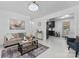 Bright, airy living room with wood floors and open layout, perfect for entertaining at 2401 Woodleaf Dr, Gastonia, NC 28052