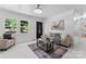 Inviting living room featuring wood flooring, natural light, and neutral decor at 2401 Woodleaf Dr, Gastonia, NC 28052
