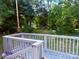 Backyard view from deck showing lush greenery and private setting with trees and open lawn at 2634 E Greenbriar Rd, Statesville, NC 28625