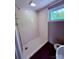 A clean bathroom with a step-in shower and geometric patterned floor is sure to please at 2634 E Greenbriar Rd, Statesville, NC 28625