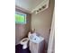 This bathroom features a modern vanity, lighting, and a toilet for convenience at 2634 E Greenbriar Rd, Statesville, NC 28625