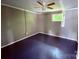 This bedroom features neutral-toned walls, ceiling fan, and a window for natural light at 2634 E Greenbriar Rd, Statesville, NC 28625