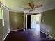 This bedroom features neutral-toned walls, ceiling fan, a closet and an adjacent doorway at 2634 E Greenbriar Rd, Statesville, NC 28625