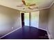 This bedroom features neutral-toned walls, ceiling fan, a closet and an adjacent doorway at 2634 E Greenbriar Rd, Statesville, NC 28625
