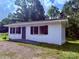 Charming home featuring dark shutters, a concrete walkway, and a neatly maintained yard at 2634 E Greenbriar Rd, Statesville, NC 28625