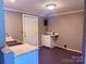 Utility sink with durable countertop, cabinets, and convenient access to external door at 2634 E Greenbriar Rd, Statesville, NC 28625