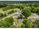 Wide aerial shot reveals a home in a neighborhood near a verdant, tree-filled expanse at 304 Miller Ave, Salisbury, NC 28144