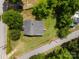 Aerial view of a charming home featuring a well-maintained lawn and mature trees at 304 Miller Ave, Salisbury, NC 28144