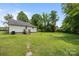 Expansive backyard with lush grass and the rear of the home at 304 Miller Ave, Salisbury, NC 28144