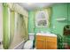 Compact bathroom features a shower-tub combination at 304 Miller Ave, Salisbury, NC 28144