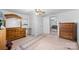 This bedroom features a dresser, fan and view into the living room at 304 Miller Ave, Salisbury, NC 28144