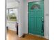 A welcoming entryway featuring a vibrant front door, complemented by stylish interior details and natural light at 304 Miller Ave, Salisbury, NC 28144