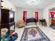 Living room featuring vintage accents, patterned rug, and a view into the kitchen at 304 Miller Ave, Salisbury, NC 28144