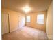 Cozy bedroom with neutral carpet, light walls, closet and windows at 318 Linsbury Ct, Gastonia, NC 28056