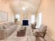 Staged living room boasting neutral walls, a fireplace, and carpet floors, offering a cozy and inviting space at 318 Linsbury Ct, Gastonia, NC 28056