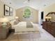 The main bedroom with large window, neutral paint, and carpet flooring at 318 Linsbury Ct, Gastonia, NC 28056