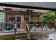 Cozy backyard deck featuring hanging plants, string lights, and an inviting seating area at 324 N 5Th St, Albemarle, NC 28001