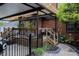 Spacious backyard with brick exterior, pergola, landscaped area, and garden at 324 N 5Th St, Albemarle, NC 28001