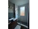 Stylish bathroom with modern subway tile shower, vintage-inspired vanity, and hexagon tile flooring at 324 N 5Th St, Albemarle, NC 28001