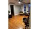 Bright bedroom with a large window, wood floors, and neutral walls perfect for a home office at 324 N 5Th St, Albemarle, NC 28001