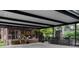 Large carport offering covered parking, a patio area, and direct access to the home's deck at 324 N 5Th St, Albemarle, NC 28001