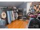 Spacious closet with ample storage, clothing racks, and shoe shelves at 324 N 5Th St, Albemarle, NC 28001