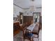 Charming dining room with wainscoting, chandelier, and connection to other rooms in the house at 324 N 5Th St, Albemarle, NC 28001