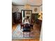 Traditional dining room featuring a chandelier, hardwood floors, and a large table for entertaining at 324 N 5Th St, Albemarle, NC 28001