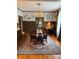Formal dining room with hardwood floors, a chandelier, and a view into the adjacent living area at 324 N 5Th St, Albemarle, NC 28001