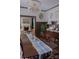 Elegant dining room with chandelier, wainscoting, and long table, adjacent to the living room at 324 N 5Th St, Albemarle, NC 28001