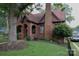 Beautiful brick home with mature trees, landscaping, and an arched front porch at 324 N 5Th St, Albemarle, NC 28001